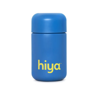Blue Hiya vitamin tablet container with yellow logo, designed for kids' essential nutrients