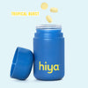 Blue Hiya vitamin tablet bottle with Tropical Burst flavor, lid off, tablets floating above