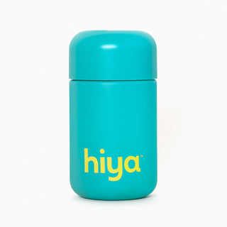 Teal Hiya vitamin tablet container with yellow logo, designed for kids' essential nutrients