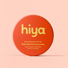Hiya Kids Mineral Sunscreen SPF 40, water resistant, in orange round container on soft pink background